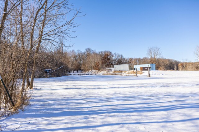 view of yard layered in snow