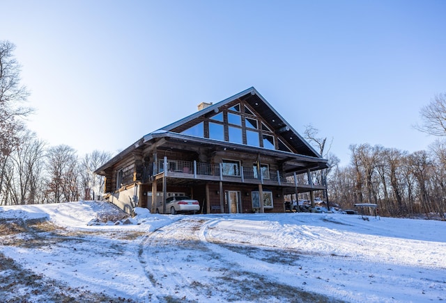 view of front of house featuring log siding