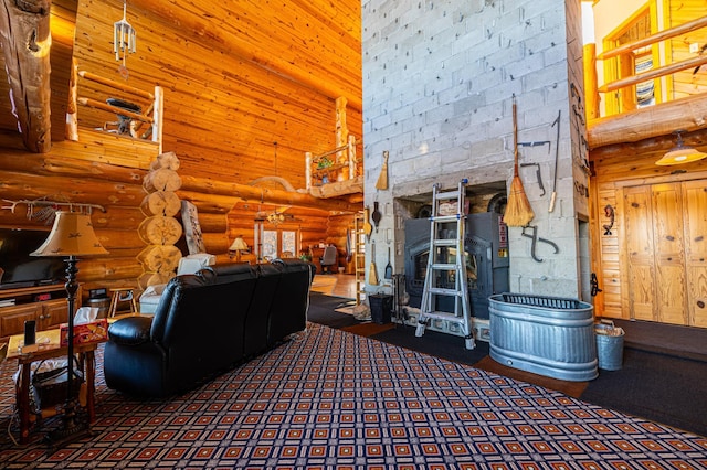 living area featuring log walls, a wood stove, and a towering ceiling