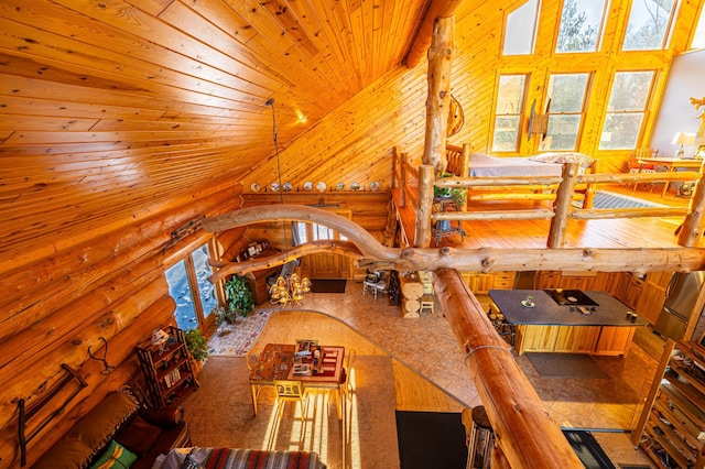 dining area with high vaulted ceiling, a wealth of natural light, rustic walls, and wooden ceiling