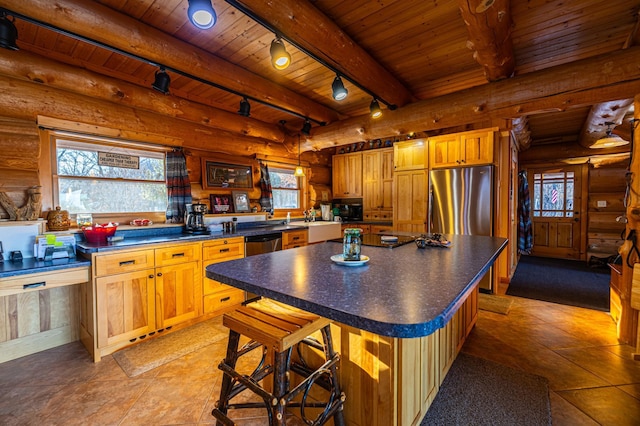 17910 27th Ave, Fair Haven Twp, MN 55320 - kitchen featuring rail lighting, wood ceiling with exposed beams, stainless steel appliances, dark countertops, and log walls