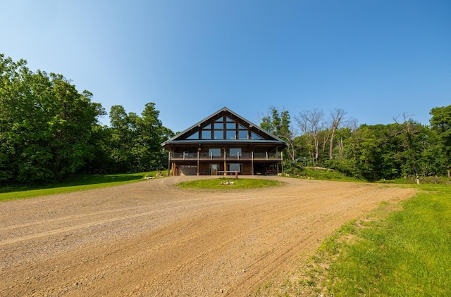 17910 27th Ave, Fair Haven Twp, MN 55320 - chalet / cabin featuring driveway and an attached garage