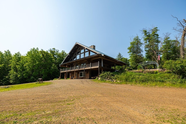 17910 27th Ave, Fair Haven Twp, MN 55320 - back of house with a chimney and a wooden deck
