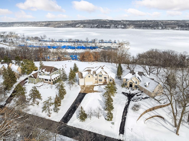 snowy aerial view featuring a residential view