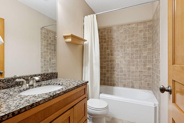 bathroom with vanity, toilet, and shower / tub combo