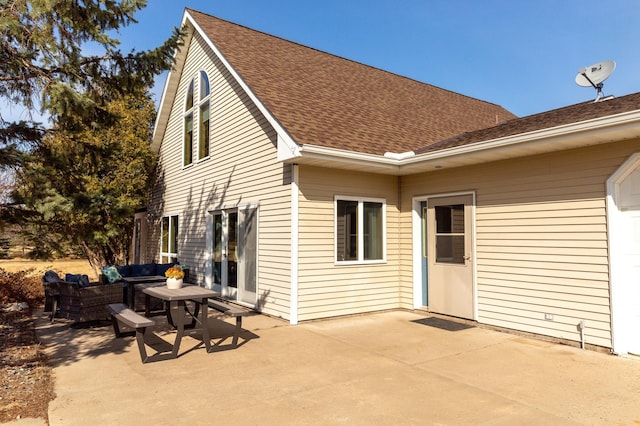 rear view of house featuring outdoor lounge area, a patio, and roof with shingles
