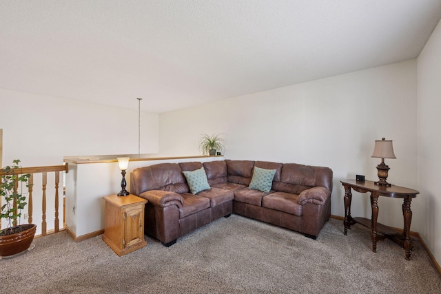 living area featuring baseboards and light colored carpet