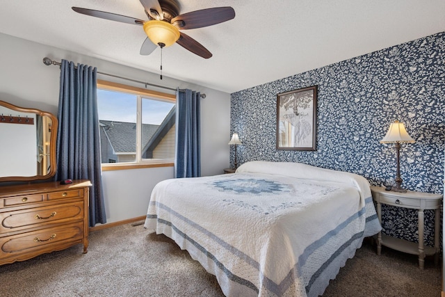 bedroom featuring a ceiling fan, baseboards, wallpapered walls, a textured ceiling, and carpet flooring