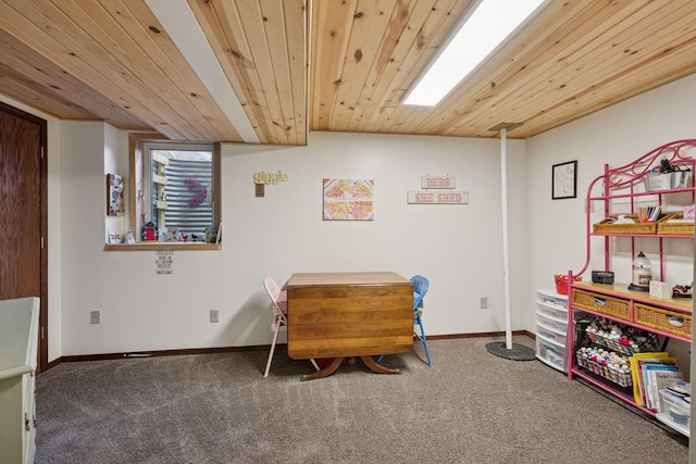 playroom featuring baseboards, wood ceiling, and carpet flooring