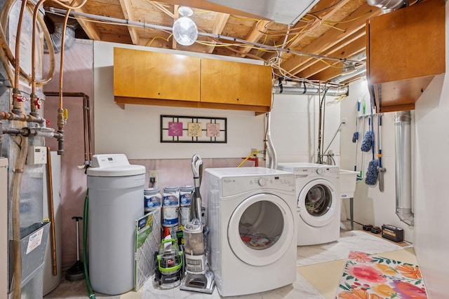 washroom featuring washer and dryer and laundry area