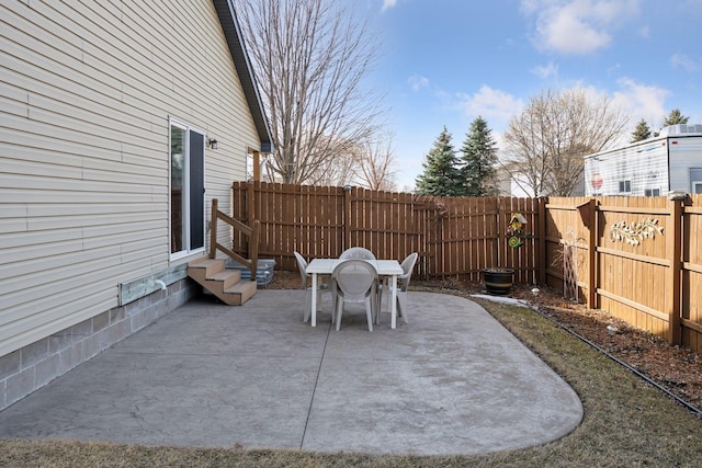 view of patio featuring entry steps and a fenced backyard