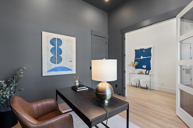 home office featuring light wood finished floors and baseboards