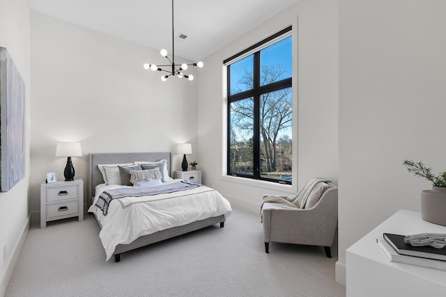 bedroom featuring carpet flooring, baseboards, and an inviting chandelier