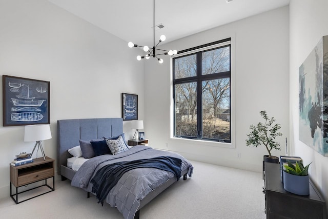 bedroom with multiple windows, carpet, visible vents, and a notable chandelier