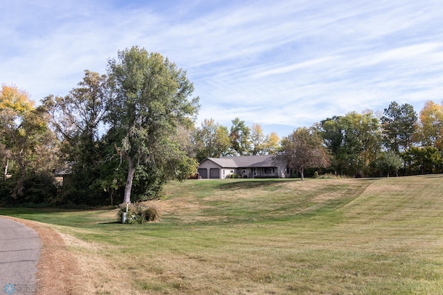 view of yard featuring an attached garage