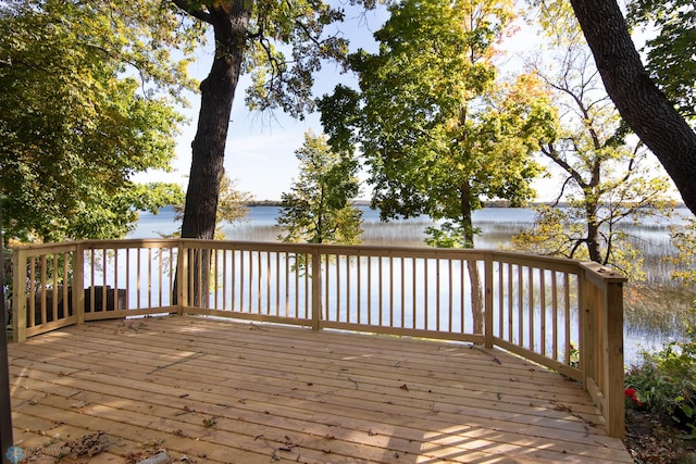 wooden deck with a water view