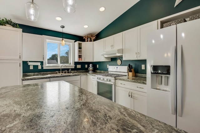 kitchen featuring white appliances, a sink, white cabinets, and under cabinet range hood