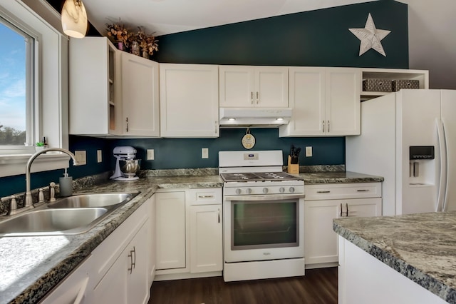 kitchen with white appliances, white cabinets, a sink, and under cabinet range hood