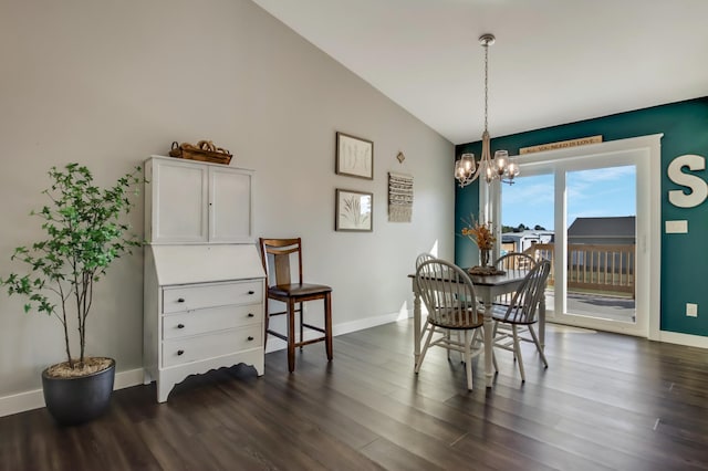 dining space featuring a chandelier, vaulted ceiling, dark wood-style floors, and baseboards