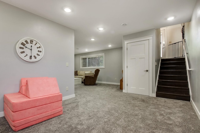 living area with recessed lighting, carpet flooring, stairway, and baseboards