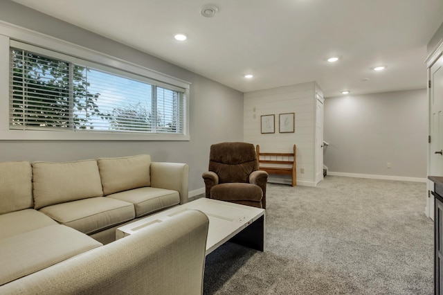 living room with light carpet, recessed lighting, and baseboards