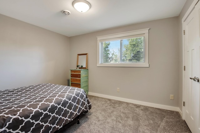 bedroom featuring carpet floors and baseboards