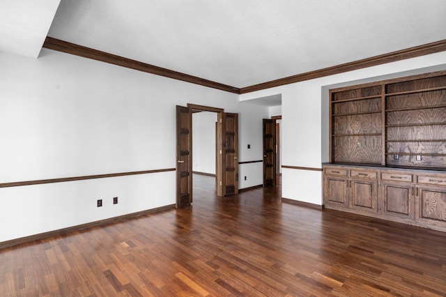 unfurnished living room with baseboards, dark wood finished floors, and ornamental molding