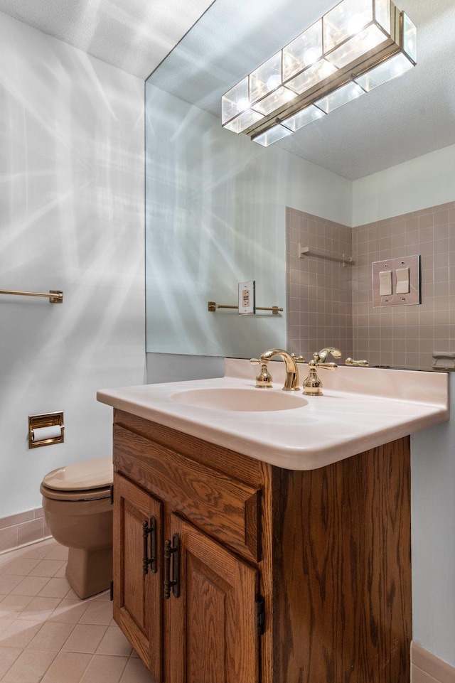 bathroom with tile patterned floors, toilet, and vanity