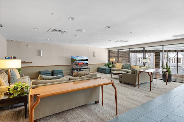 living area featuring recessed lighting and visible vents