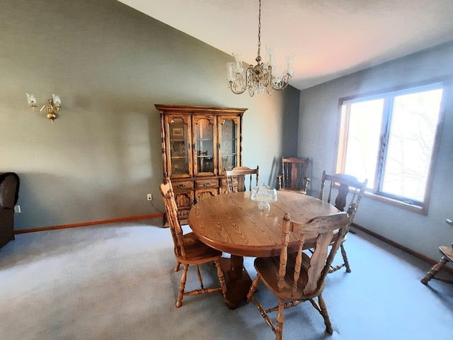 carpeted dining area featuring vaulted ceiling, baseboards, and a notable chandelier