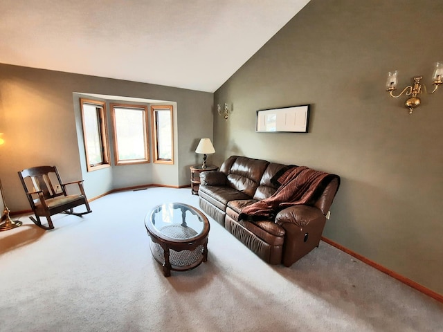 living area with carpet floors, baseboards, and lofted ceiling