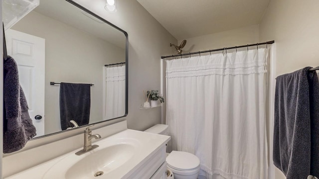 full bathroom with toilet, vanity, and a shower with curtain