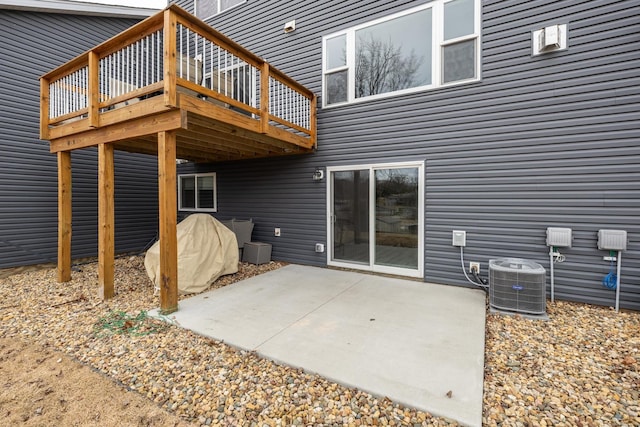 view of patio featuring central AC and a wooden deck