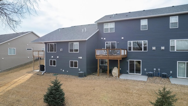 rear view of house featuring a patio, central AC unit, and a wooden deck