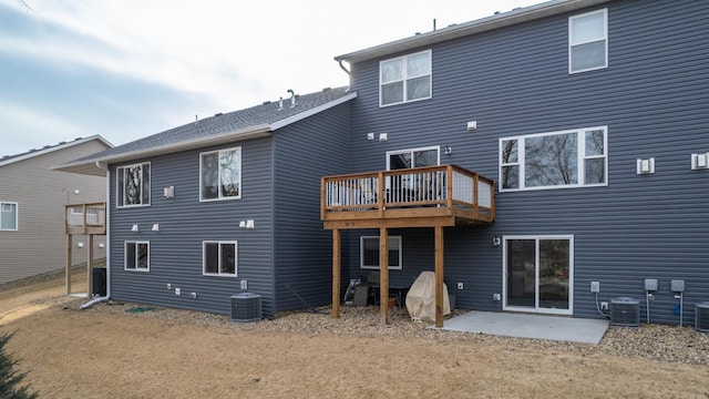 rear view of house with a patio area and central air condition unit