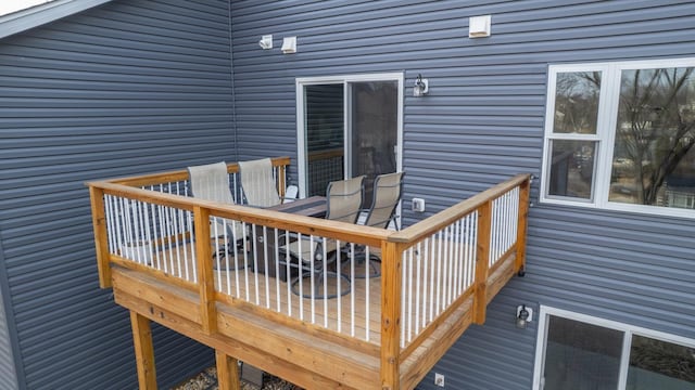 wooden deck with outdoor dining area