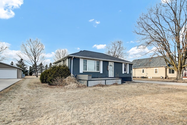 view of front of house featuring an outbuilding and a detached garage