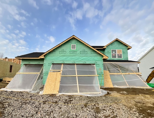 exterior space featuring fence and stucco siding