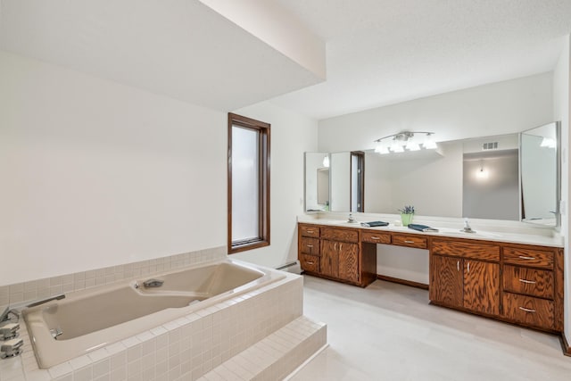 full bath with a garden tub, double vanity, visible vents, baseboard heating, and a sink