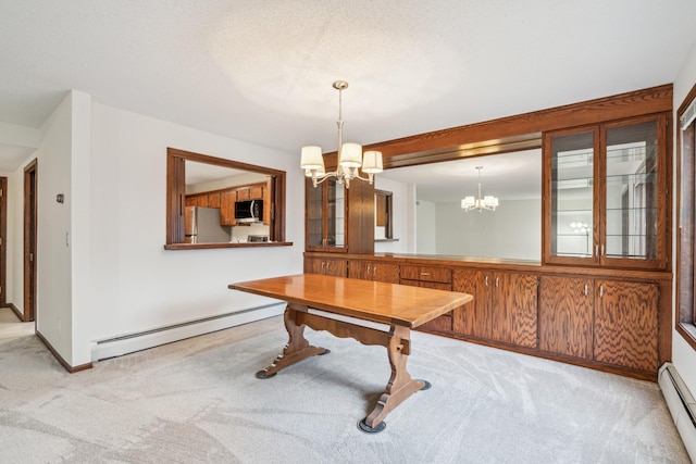 rec room featuring a chandelier, light colored carpet, and baseboard heating