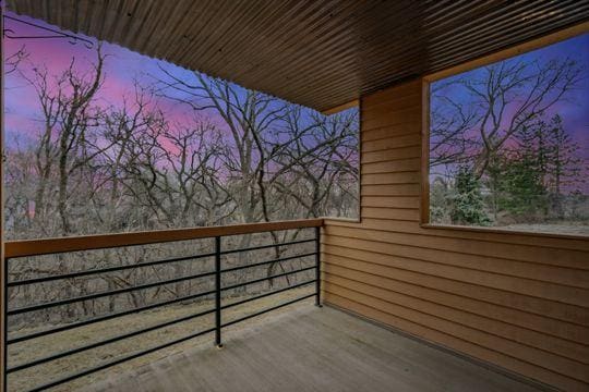 view of balcony at dusk