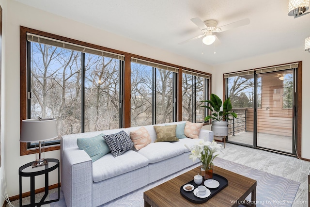 sunroom / solarium with ceiling fan