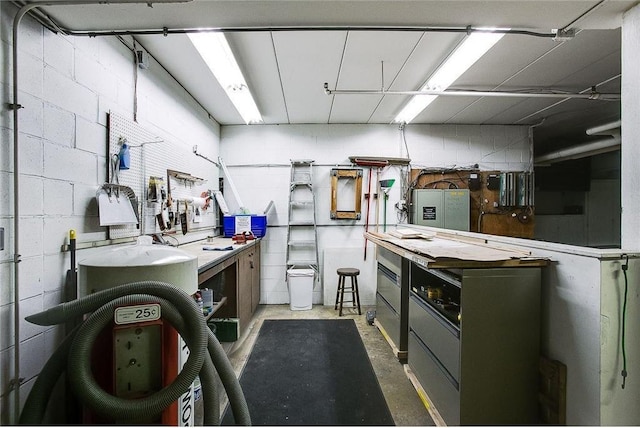 kitchen with concrete block wall and concrete floors