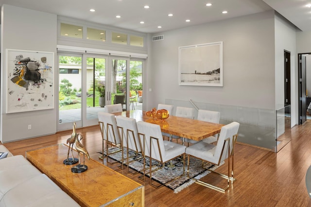 dining space with recessed lighting, visible vents, and wood finished floors