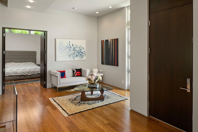 living room with hardwood / wood-style flooring and recessed lighting