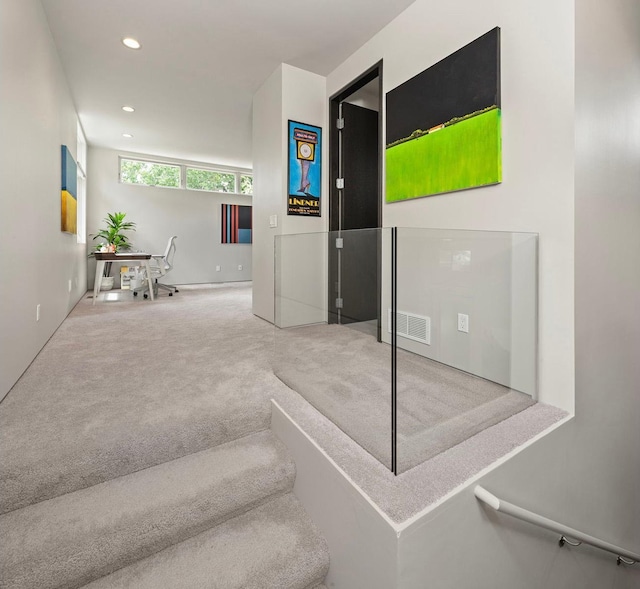 staircase featuring carpet, visible vents, and recessed lighting