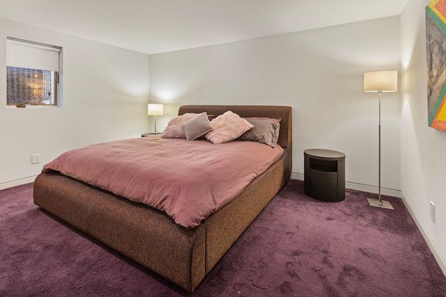 bedroom featuring carpet floors and baseboards