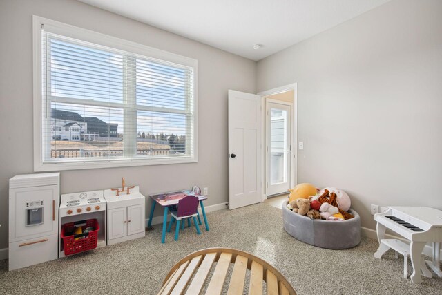 game room with carpet floors and baseboards