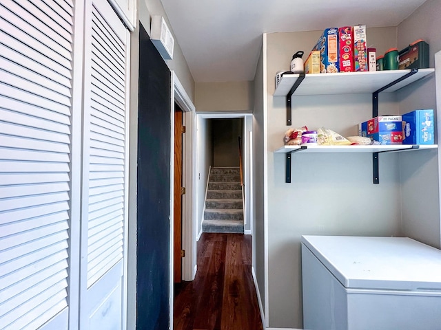 laundry area featuring wood finished floors