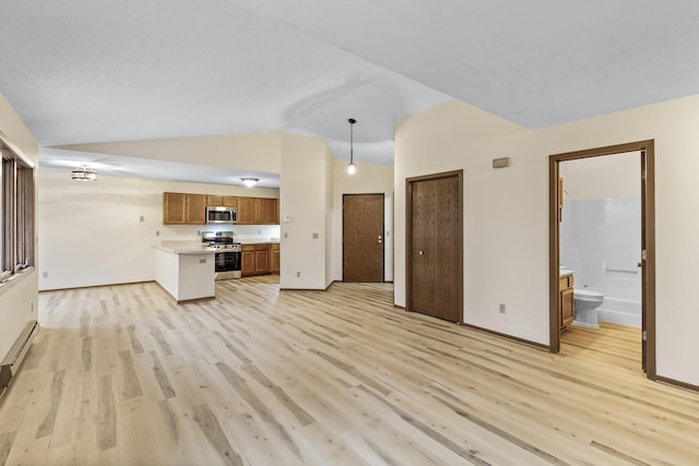 unfurnished living room with lofted ceiling, light wood-style flooring, and baseboards